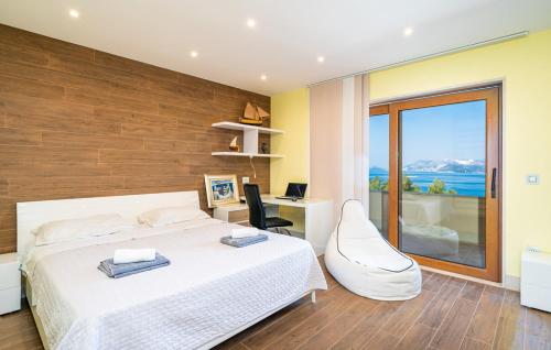 Ένα ή περισσότερα κρεβάτια σε δωμάτιο στο Villa Perpera