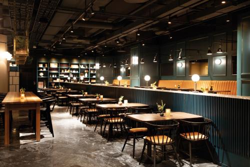 a row of tables and chairs in a restaurant at Elite Palace Hotel & Spa in Stockholm