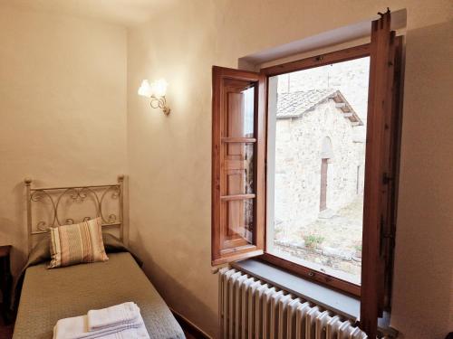 Posteľ alebo postele v izbe v ubytovaní Chianti Craft House Badia a Passignano