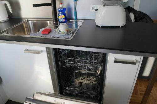 an oven with its door open in a kitchen at Köln Deutz/Messe, Lanxess Arena in Cologne
