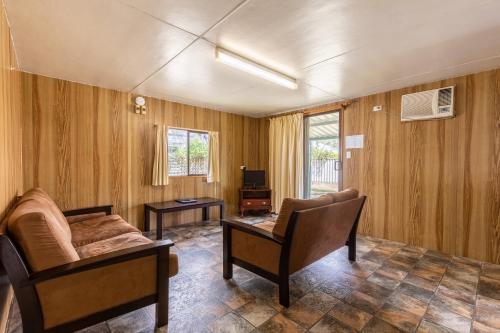a living room with a couch and a table at Lazy Days Caravan Park in Vasse