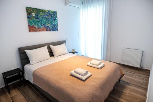 Cama ou camas em um quarto em Cozy apartment in Palaio Faliro with a great view (D2)