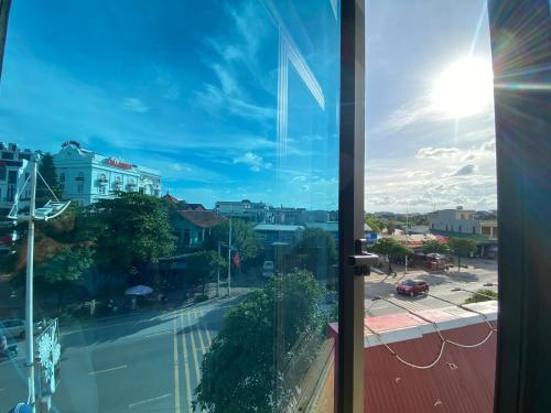 a view of a city street from a window at Nhà nghỉ FAMY in Móng Cái