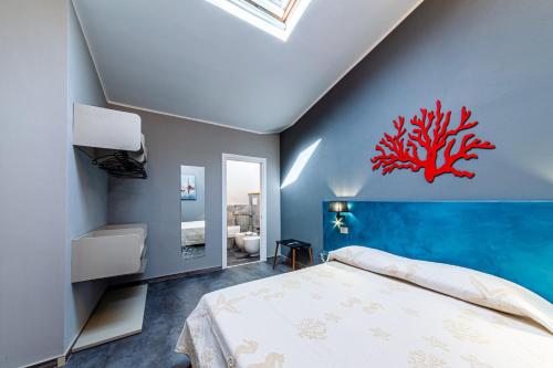 Un pat sau paturi într-o cameră la RELAIS IL CORALLO