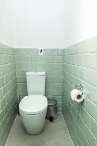 a bathroom with a toilet and a roll of toilet paper at Creta Vitalis in Kalathas