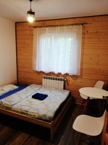Ένα ή περισσότερα κρεβάτια σε δωμάτιο στο Dom - nad Potokiem