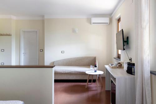 a small living room with a couch and a table at Tenuta Lamborghini Golf & Resort in Panicale