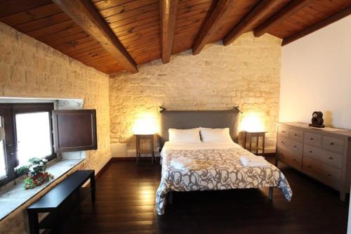 Ένα ή περισσότερα κρεβάτια σε δωμάτιο στο Villa Antica Aia
