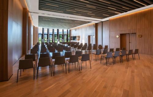 a large room with chairs and tables in it at Hyatt Regency Taghazout in Taghazout