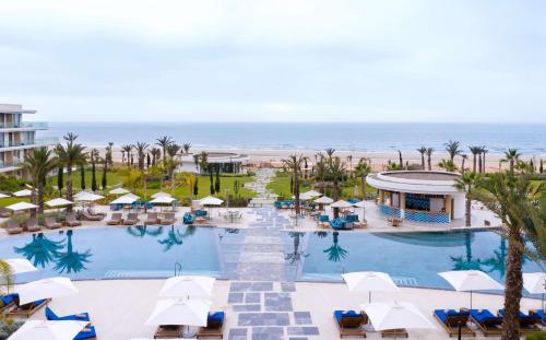 an aerial view of a resort with a pool and the ocean at Hyatt Regency Taghazout in Taghazout