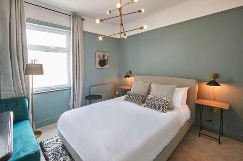 a bedroom with a large white bed and a window at Host & Stay - The Railman's House in York