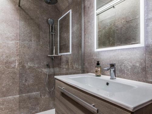 a bathroom with a sink and a shower at Pass the Keys Peaceful And Beautiful Barn In Downland Village in Chichester