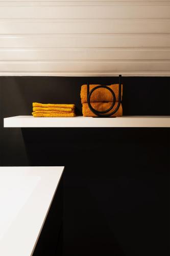 a shelf with a purse sitting on top of it at B&B Maison Blanche in Ghent