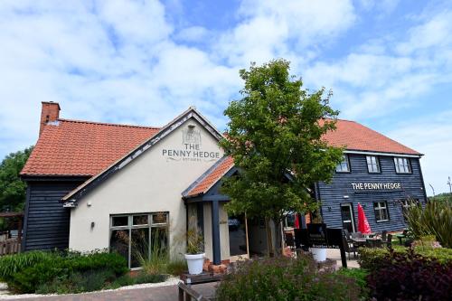 a building with a sign that reads the pawn house at Penny Hedge, Whitby by Marston's Inns in Whitby