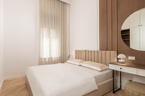 Ένα ή περισσότερα κρεβάτια σε δωμάτιο στο Plaza Apartments