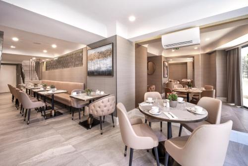 a restaurant with tables and chairs in a room at Mula Hotel in Istanbul
