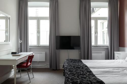 Postel nebo postele na pokoji v ubytování Elite Hotel Savoy
