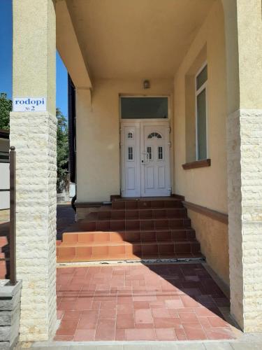 a front door of a building with a set of stairs at The Cohen's Guest House in Kyustendil