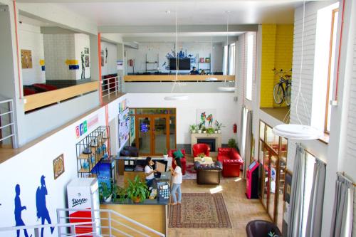 an overhead view of a living room with people in it at ololoFreelander Hostel&Coworking in Bishkek