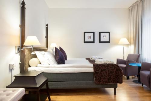 Postel nebo postele na pokoji v ubytování Elite Hotel Arcadia
