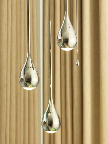 three spoons hanging from a wall at St Martins Lane London in London