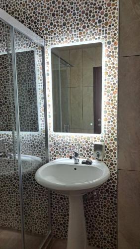a bathroom with a sink and a mirror at Villa Malezan in Ohrid