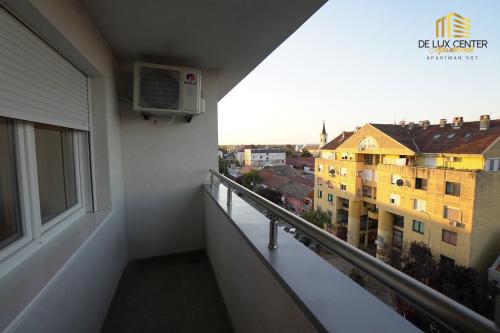 a balcony with a view of a building at DeLux Center Apartments Inđija in Inđija