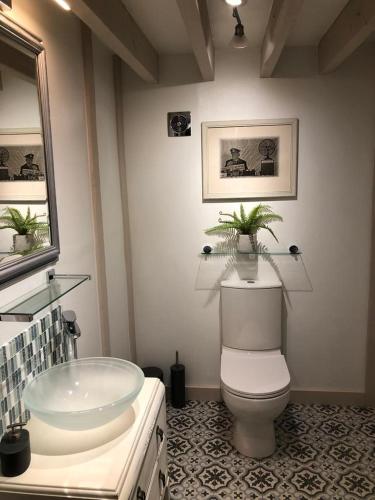 a bathroom with a sink and a toilet and a tub at Beautiful Barn Conversion, 3 Bed, hot tub, sauna, gym, enclosed garden in Ryde