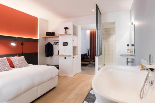 Postel nebo postele na pokoji v ubytování MiHotel Charité