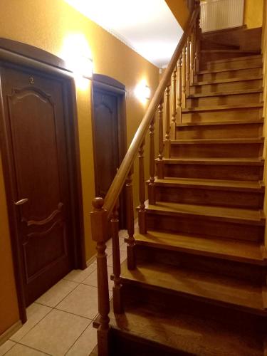 a staircase in a house with a stair case at Rodina Hotel in Odesa