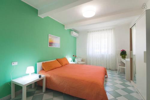 Un pat sau paturi într-o cameră la B&B Porta Della Sicilia