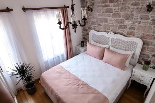 Ένα ή περισσότερα κρεβάτια σε δωμάτιο στο Barıs Otel Cunda