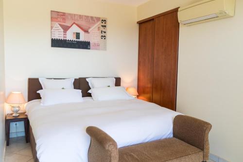 En eller flere senge i et værelse på Villa bord de mer avec piscine chauffée