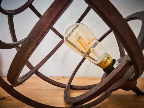 a glass jar on top of a wooden wheel at Mooiste plek heuvelland in Zuid-Limburg-De Wijngaard in Vijlen