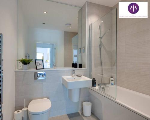 a bathroom with a sink and a toilet and a shower at Stevenage Luxury 1Bed Apartment - Sleeps 4-WIFI-Free Parking- By JM Short Lets & Serviced Accommodation in Stevenage