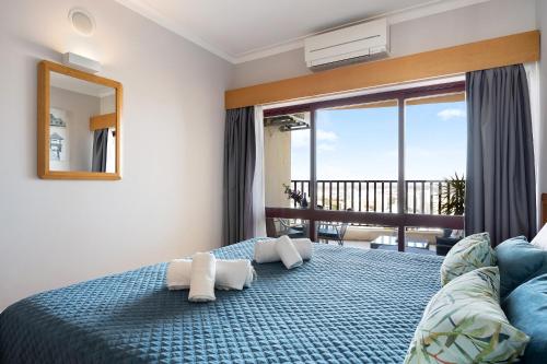 Ένα ή περισσότερα κρεβάτια σε δωμάτιο στο Sunny Escape