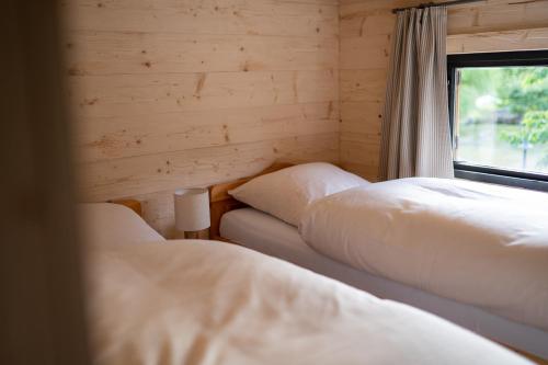 Cama o camas de una habitación en Hüttenresort Mare