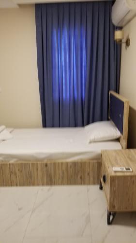 Ένα ή περισσότερα κρεβάτια σε δωμάτιο στο Huge Evleri 1