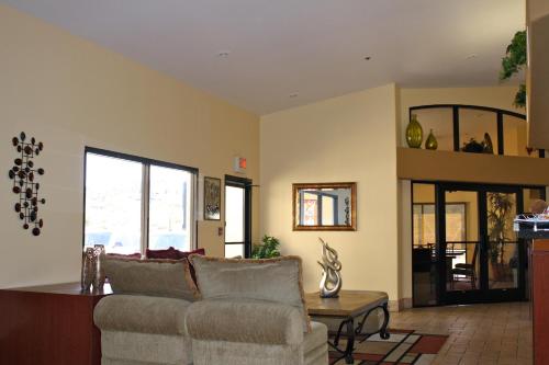 a living room with a couch and a table at Days Inn by Wyndham Globe in Globe