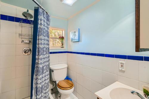 a bathroom with a toilet and a sink at Flamingo Casita in West Palm Beach