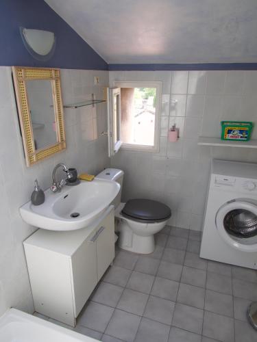 a small bathroom with a sink and a toilet at Verdon Secret - L'escapade parfaite in Gréoux-les-Bains