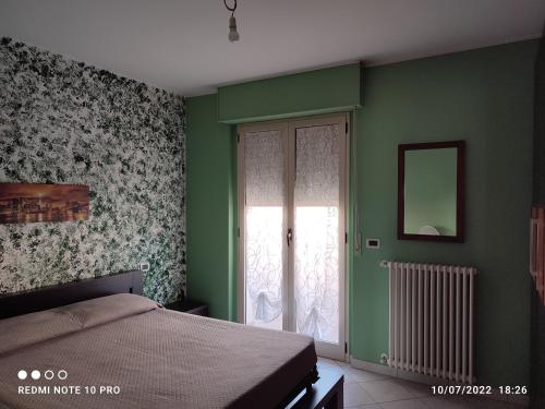 Ліжко або ліжка в номері Appartamento Scerne di Pineto