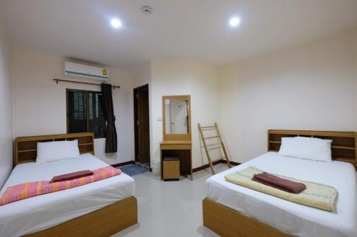 En eller flere senge i et værelse på Phi Phi Blue Lagoon