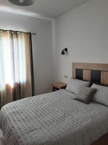 Giường trong phòng chung tại Casa sol y mar