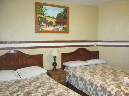 Ένα ή περισσότερα κρεβάτια σε δωμάτιο στο Posada Arny