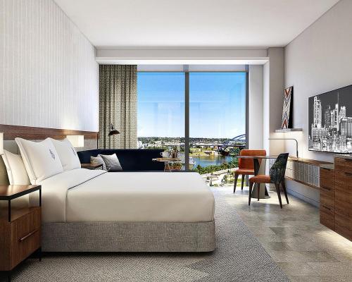 a bedroom with a large bed and a large window at Four Seasons Hotel Nashville in Nashville