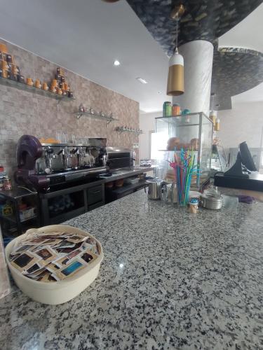 a kitchen with a granite counter top in a kitchen at HOTEL CASTIYA in M'diq