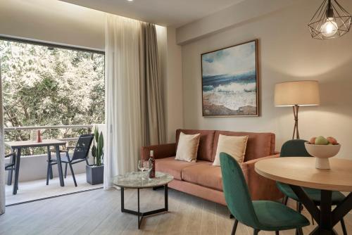 a living room with a couch and a table at Hestia - Asklipiou 61 in Athens