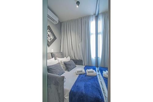 Cama o camas de una habitación en anyLife Smart Higienópolis