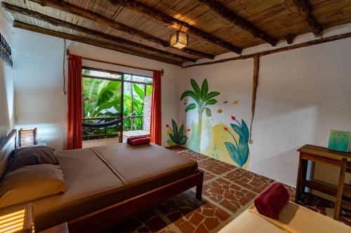 A bed or beds in a room at Suites La Tortuga
